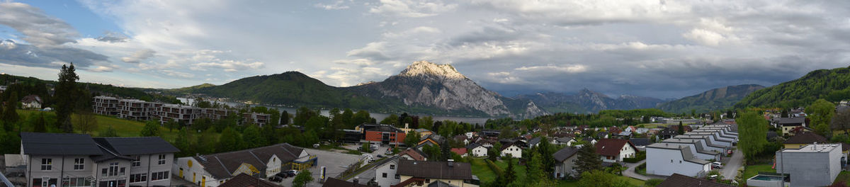 High angle view of houses and mountains against sky