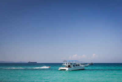 Scenic view of sea against clear blue sky