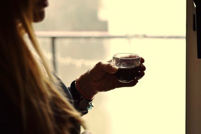 Close-up of a woman drinking glass