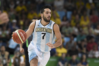 Portrait of man playing basketball