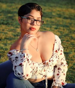 Portrait of woman sitting outdoors