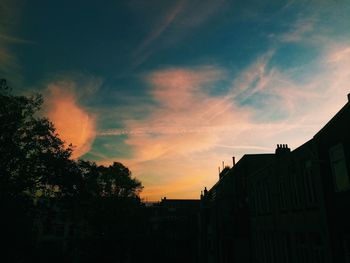 Built structure against sky at sunset