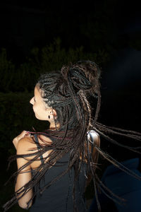 Girl with long braids dancing alone