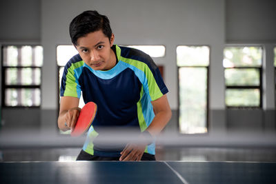 Boy playing tennis