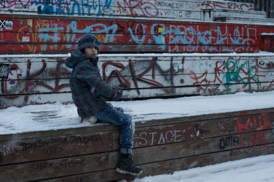 Side view of a boy in snow