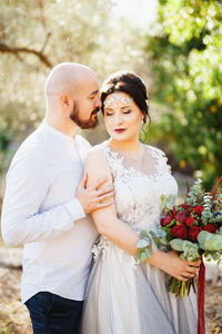Young couple standing outdoors