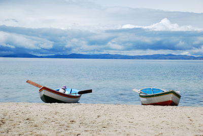 Boats moored in sea