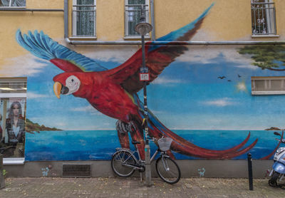 Bicycle parked in front of building