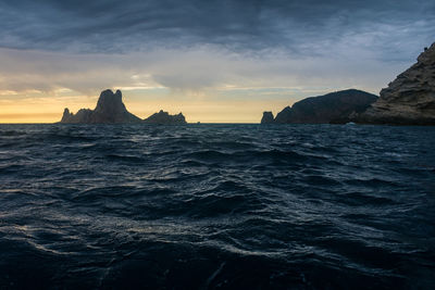 Dramatic sunset near the magic island of es vedrà