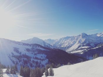 Scenic view of snowcapped mountains against sky