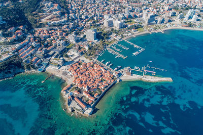 Old town in budva in a beautiful summer day, montenegro. aerial image