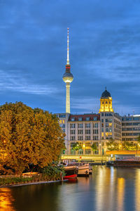 The river spree in berlin at night with the tv tower in the back