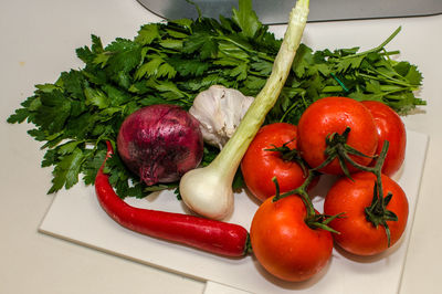 High angle view of vegetables on cutting board in kitchen