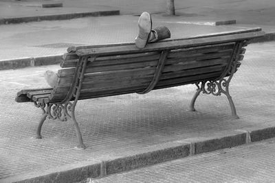 Person sleeping on bench