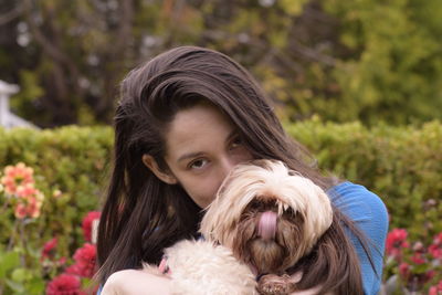 Portrait of teenage girl with dog