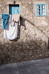 Laundry hanging outside house