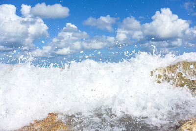 Sea waves splashing on shore