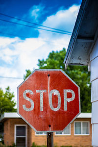 Stop sign against sky