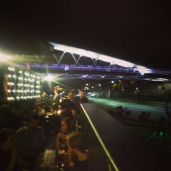 Blurred motion of people in city at night