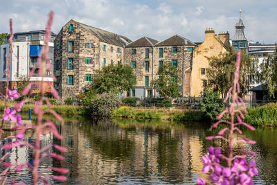 View of buildings against cloudy sky