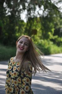 Young woman standing in park