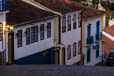 Houses by street in city