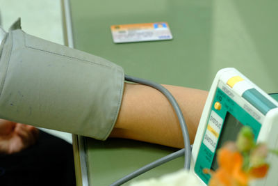Close-up of hand holding book