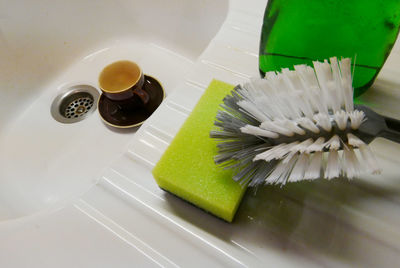 High angle view of cleaning objects by sink