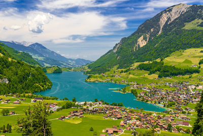 Scenic view of lake and mountains against sky