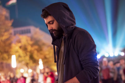 Young man at music concert at night