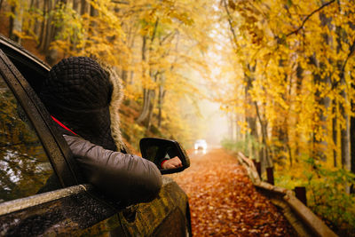 Man sitting in park during autumn