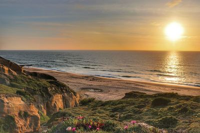 Scenic view of sea against sky during sunset