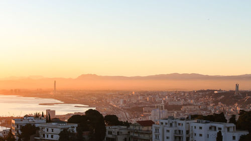 High angle view of townscape against sky during sunset