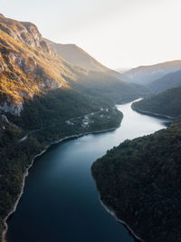 Scenic view of lake and mountains against clear sky. lake prisaca, domogled ,valea cernei.	