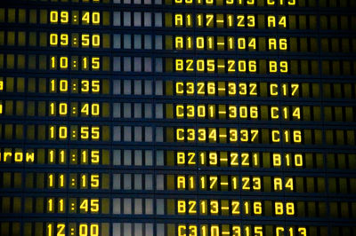 Low angle view of airport departure and arrival sign