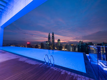 View of swimming pool at night