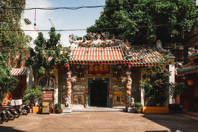 Entrance of temple against building