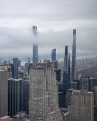 Modern buildings in city against sky