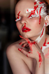 Close-up of young woman with face paint