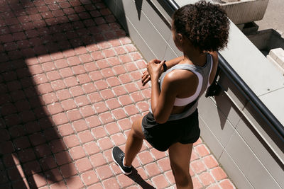 High angle view of woman on footpath