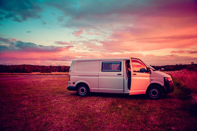 Vintage car against sky during sunset