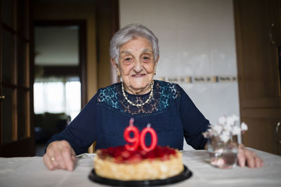 Portrait of senior woman celebrating her ninetieth birthday