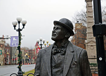 Statue of people on street