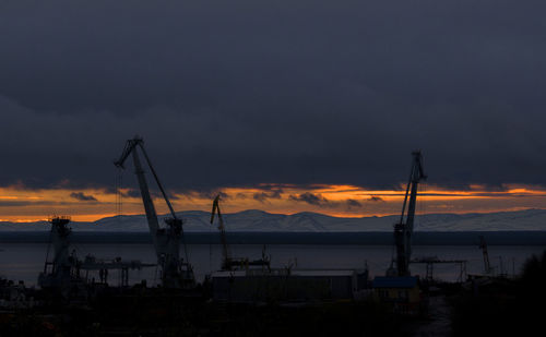 Scenic view of silhouette mountains against sky during sunset