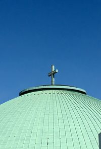 Low angle view of modern building against clear blue sky