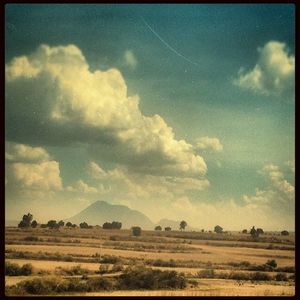 Scenic view of landscape against cloudy sky