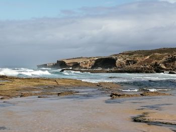 Scenic view of beach against sky