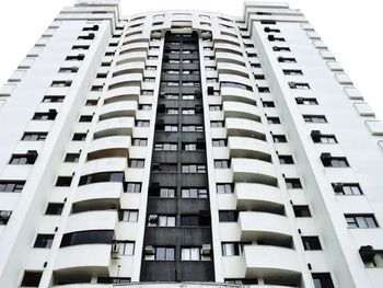 Low angle view of modern buildings in city against sky