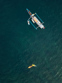 High angle view of people swimming in sea