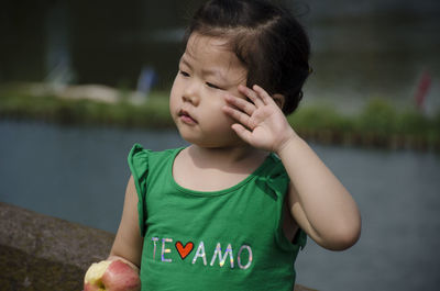 Close-up of boy against water